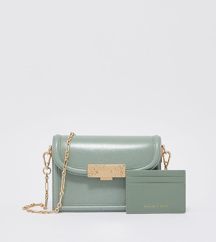 Genevieve metallic accent crossbody bag in sage green.