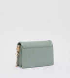 Genevieve metallic accent crossbody bag in sage green.