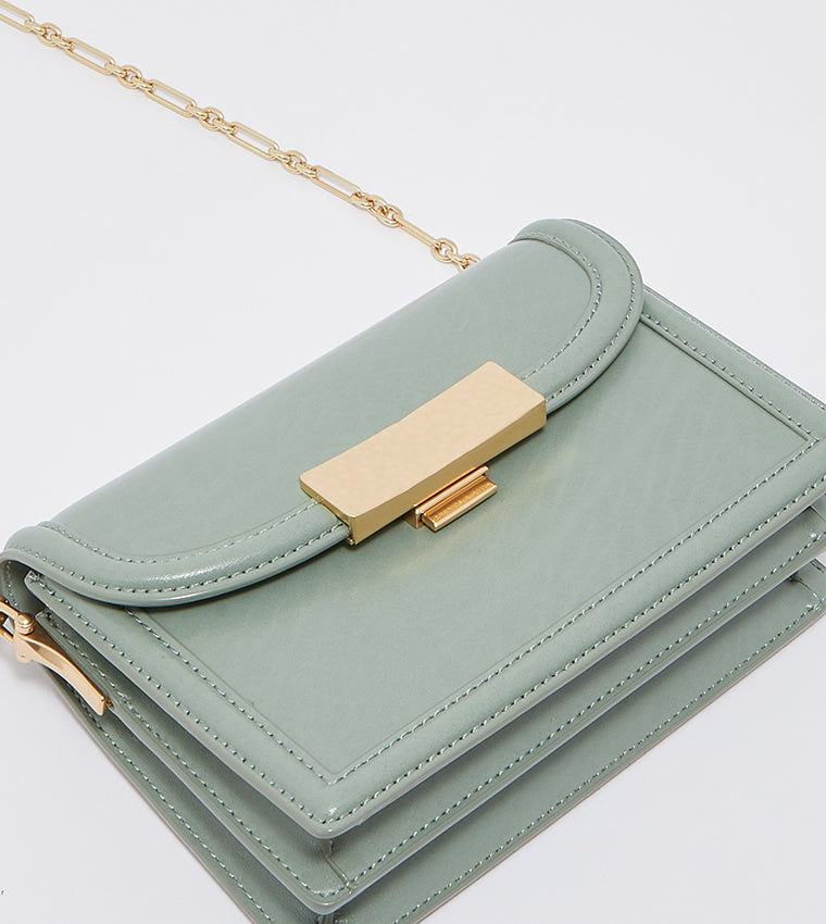 Genevieve metallic accent crossbody bag in sage green.