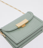 Genevieve metallic accent crossbody bag in sage green.