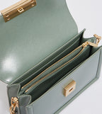 Genevieve metallic accent crossbody bag in sage green.