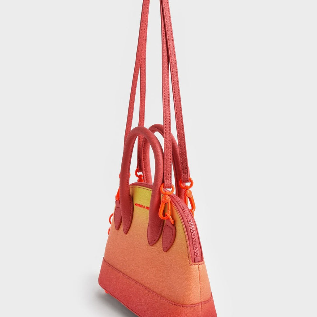 Harmonee Bowling Bag in an orange and yellow gradient color.