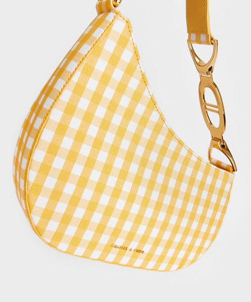 Asymmetrical Shoulder Bag in a yellow and white gingham (plaid) pattern.