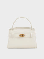 Aubrielle metallic-buckle top handle bag in cream