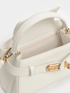 Aubrielle metallic-buckle top handle bag in cream