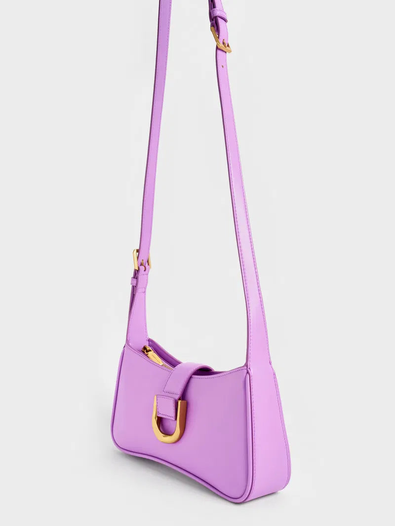 Gabine curved shoulder bag in violet faux leather