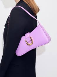Gabine curved shoulder bag in violet faux leather