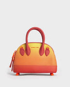 Harmonee Bowling Bag in an orange and yellow gradient color.