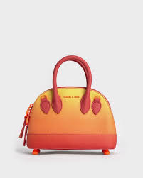Harmonee Bowling Bag in an orange and yellow gradient color.