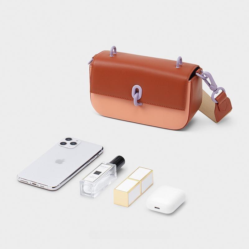 Wren Acrylic Handle Phone Pouch in a brick or orange color.