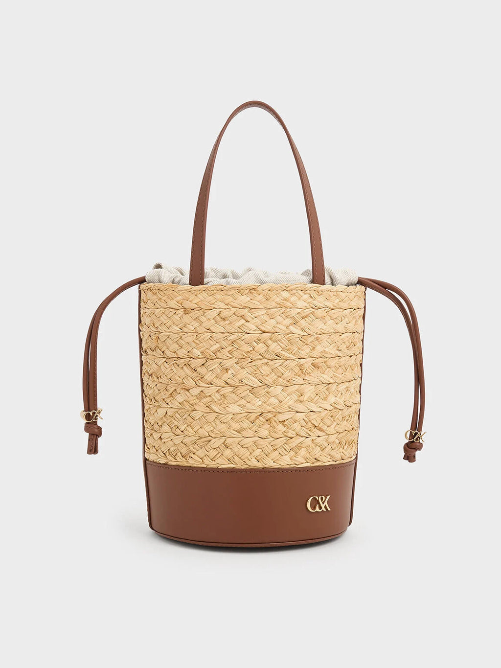 leather and raffia bucket bag