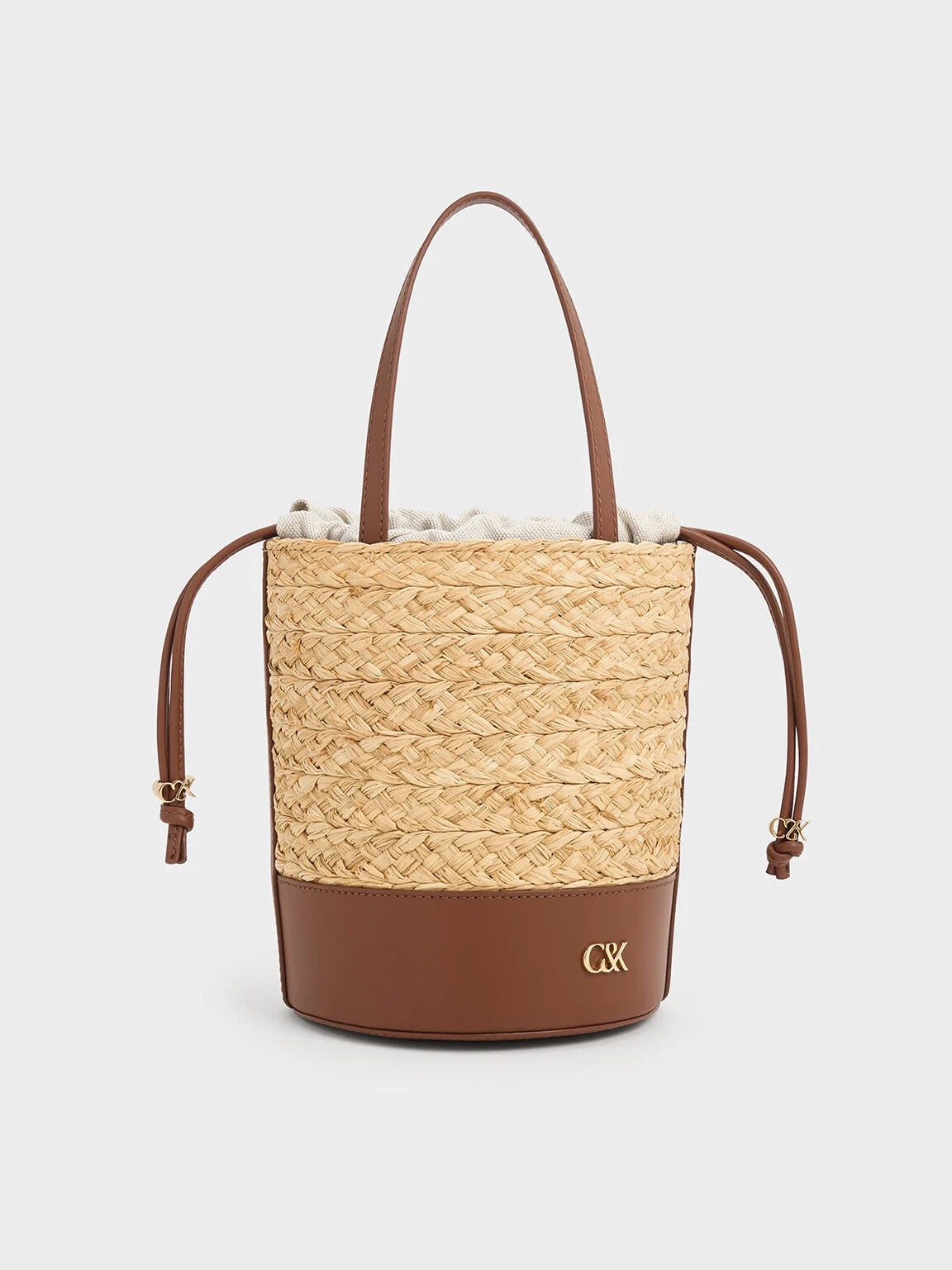 leather and raffia bucket bag