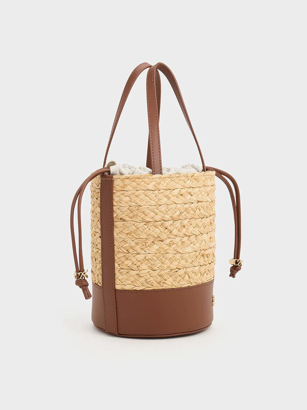 leather and raffia bucket bag