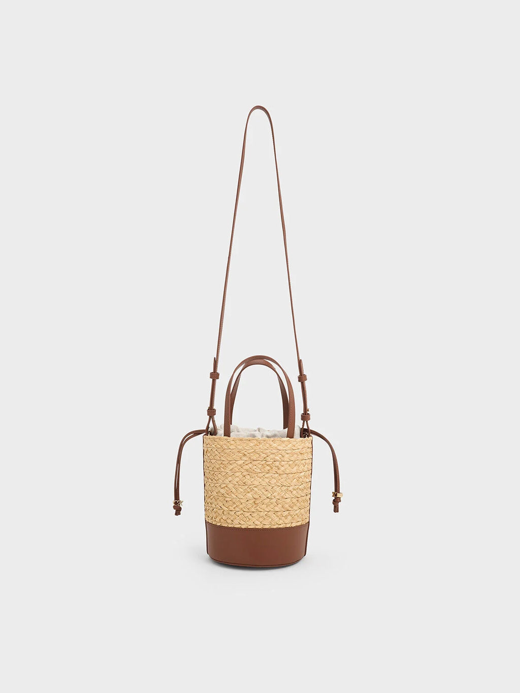 leather and raffia bucket bag