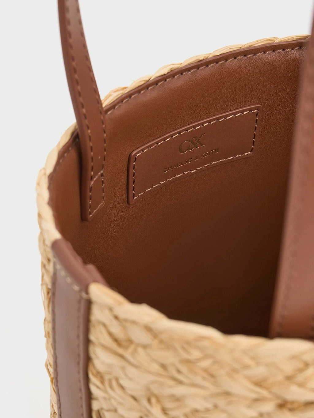 leather and raffia bucket bag