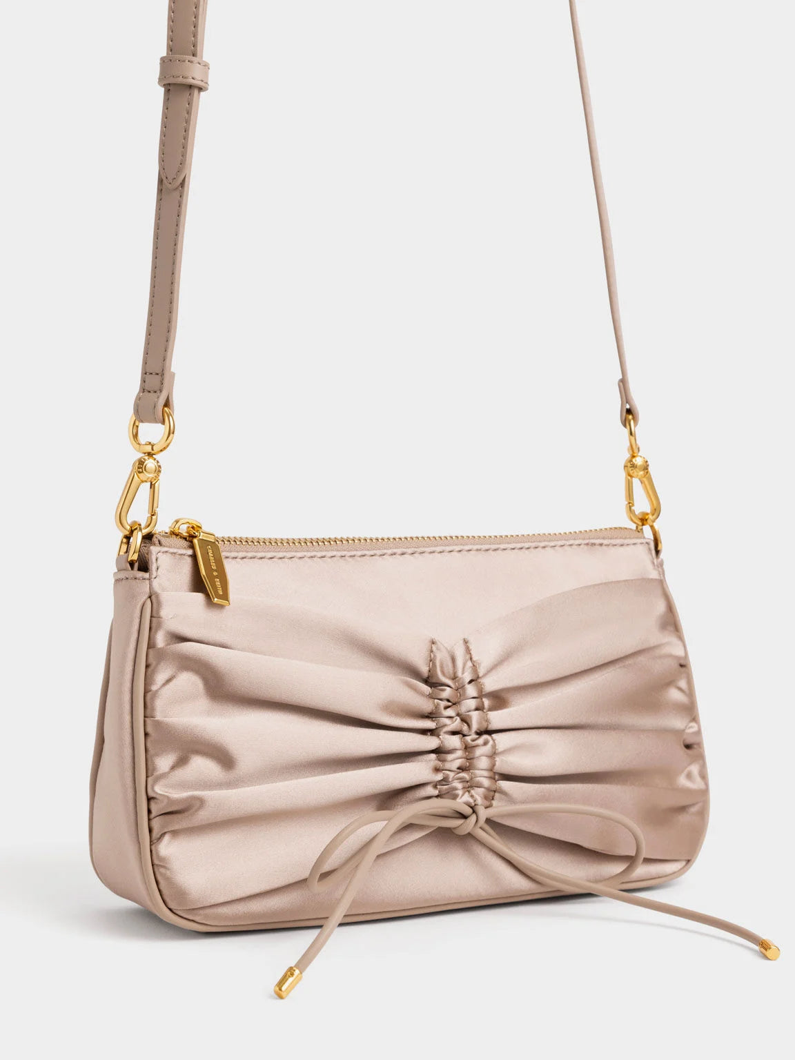 ruched mini shoulder bag with a faux pearl chain strap.