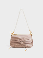 ruched mini shoulder bag with a faux pearl chain strap.